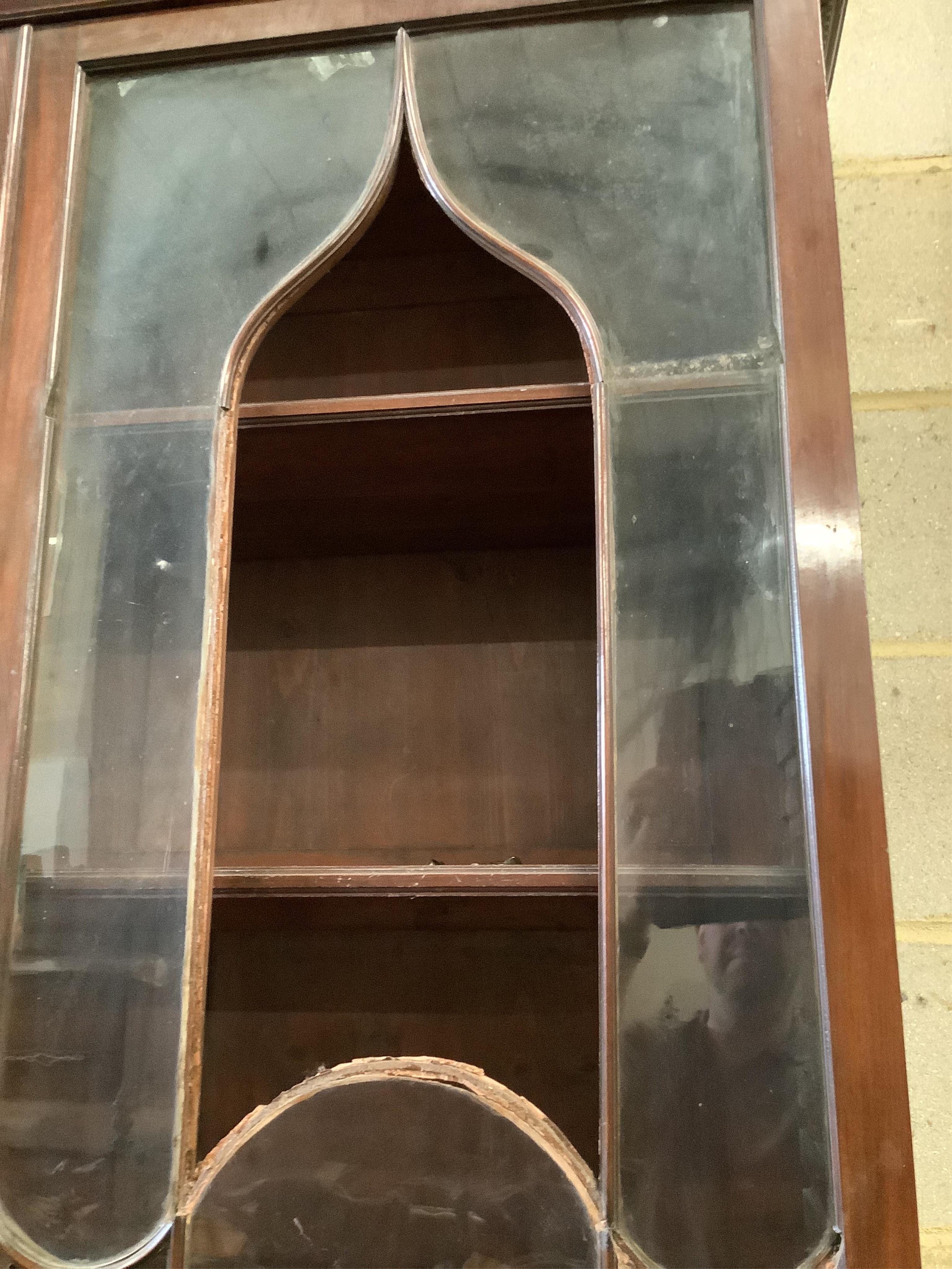 A George III mahogany secretaire chest, fitted with a later glazed two door bookcase, width 112cm, depth 56cm, height 247cm. Condition - poor